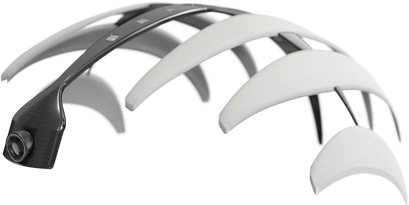 The rendered Halo: a dark carbon band with small sensor nodes and a camera at its front end, holding white pads that arc over the head.