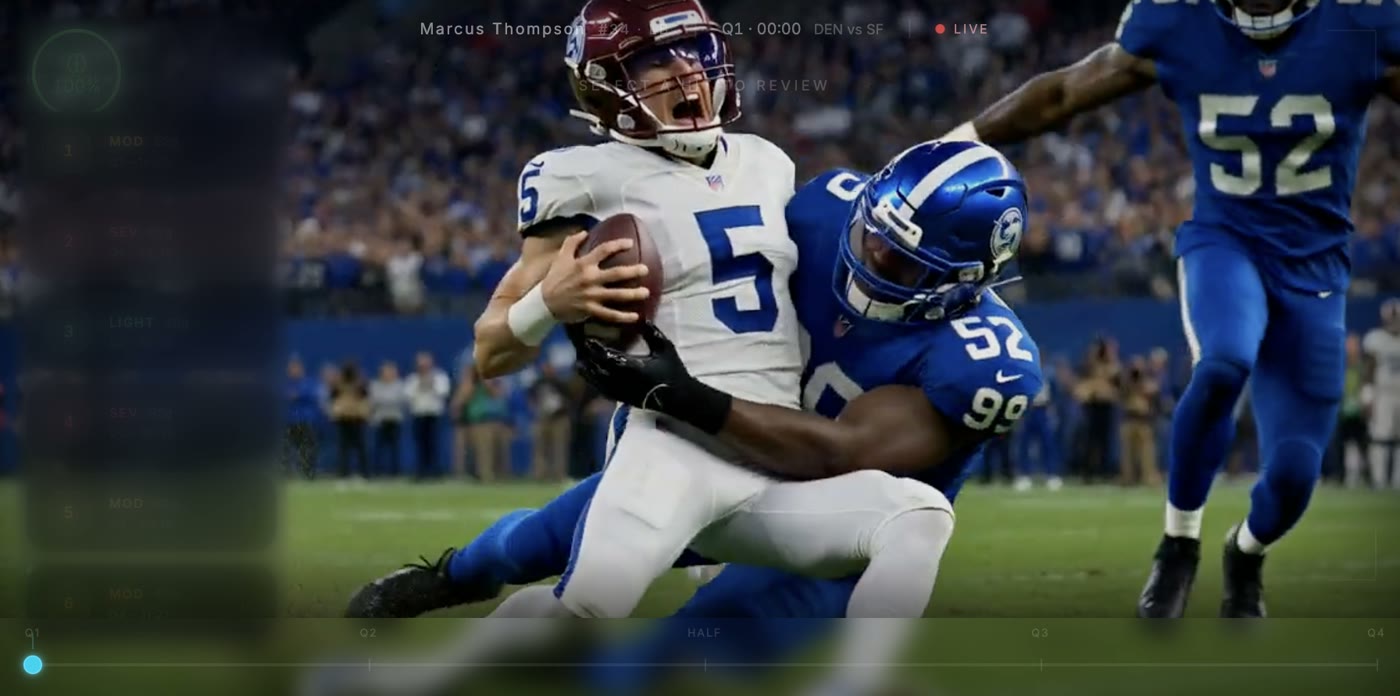 Stadium broadcast footage of a tackle during a game.